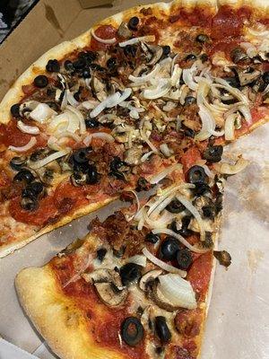 Pepperoni, mushrooms, olives, onions, bacon - yum!