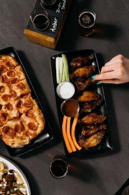 Why choose? Our Honey Pig pizza and beer-brined chicken wings made a perfect pair.