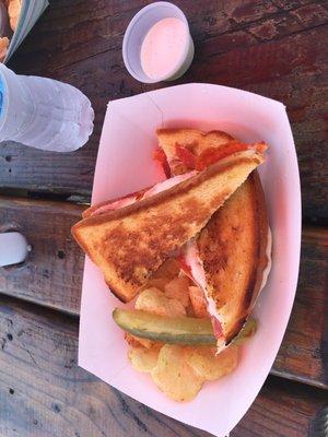 Pizza melt with chips and pickle