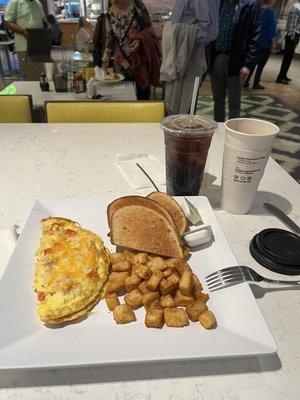 Western Omelette platter with hash browns and rye toast. Large coffee and soda.