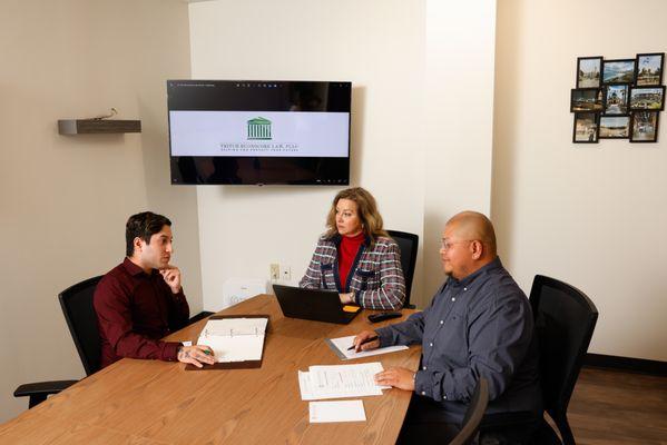 The staff at TB Law, Lead attorney Margaret, with Julio and Saroth.