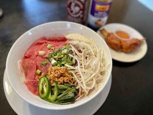 Always order your noodles uncooked and your thinly sliced beef raw and reheat the broth to boiling and put over the arranged bowl.