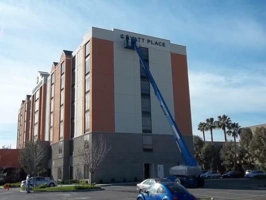 Vent screen installation using 100' man-lift.