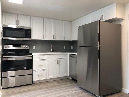 Newly renovated apartments with custom cabinets, stainless appliances, and quartz countertops.