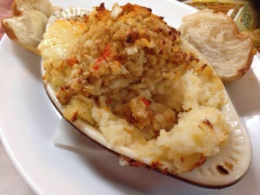 "Dutch" crab cake served atop a plate of mashed potato