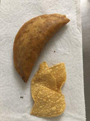 Beef empanada w a few tortilla chips. This is half of what the order was, I ate the other empanada already.