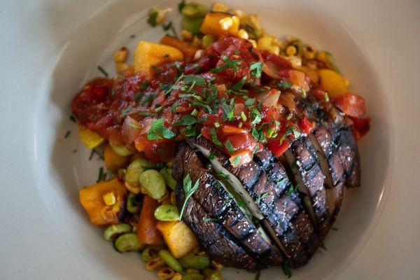 WARM WINTER SQUASH SUCCOTASH: Winter squash, lima beans, and corn sautéed, complemented with a grilled portabella mushroom and vegan Creole.