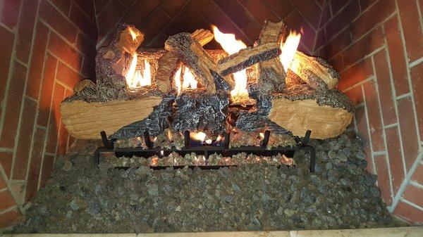 Gas log set, beautiful realistic look. Call for service on your gas, wood, and pellet fireplace.