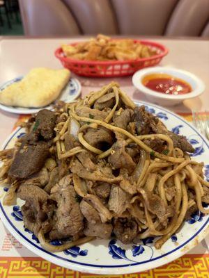 Beef, chicken, pork with noodles, onions, & cilantro