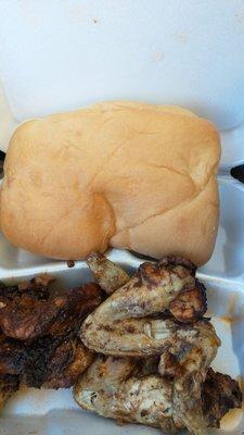 Jerk wings and coco bread