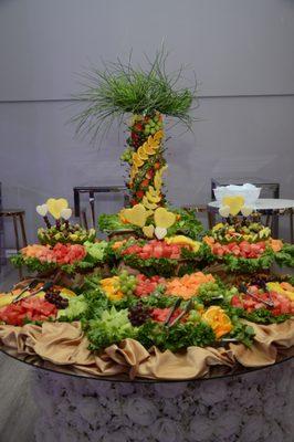 Picture was taken before the decoration was placed on the table behind the fruit.