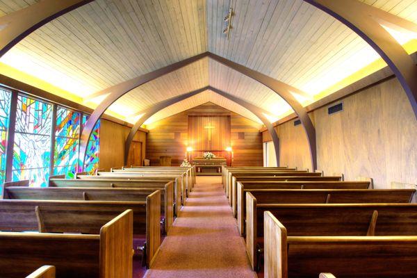 Bryan-Braker's Redwood Chapel accented with beautiful stained glass,