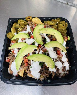 Try our delicious Truly Nachos, homemade tortilla chips, topped with refried beans, cheese, your choice of meat, sour cream, salsa, jalapeño