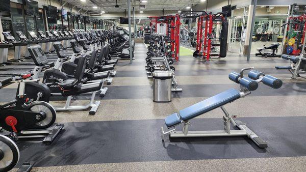 Two Giant Lanes of Cardio Equipment and Two Barbell Racks