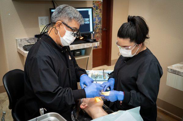 Dr. Tawatari and an assistant providing quality dental at our Philadelphia Square location.