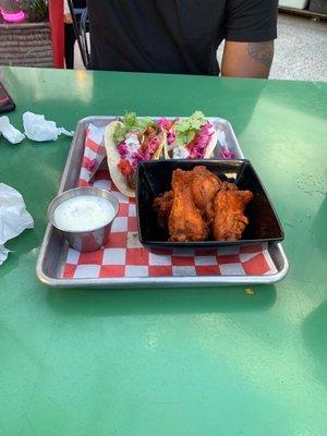 Chicken wings and two steak tacos