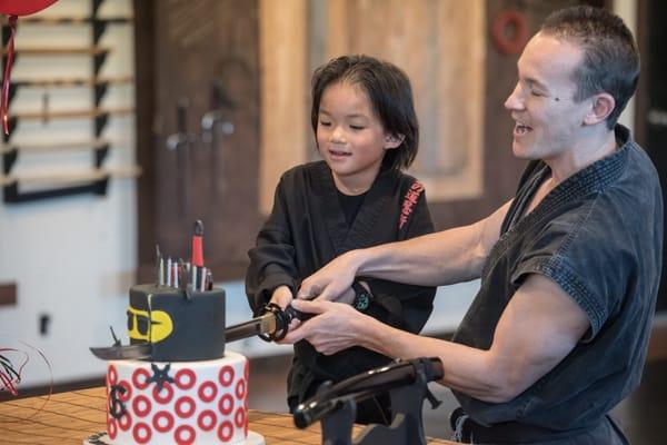 I mean...what birthday boy wouldn't want to cut the cake with the samurai sword?