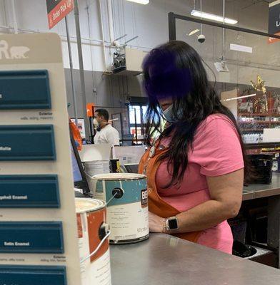 Paint counter worker with an all-too common site at this Home Depot: a mask under the chin (and therefore not effective at all).