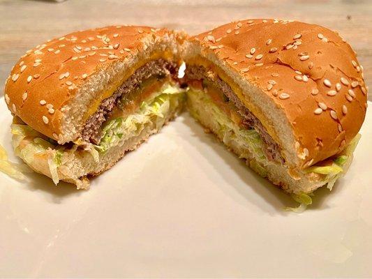 Cheeseburger. Beef patty, tomatoes, onions, cheese, lettuce, and thousand island sauce on a toasted bun. A great burger to try out!