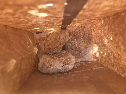 Inside the bag- powdered sugar to shake the deep fried chocolate chip cookies in