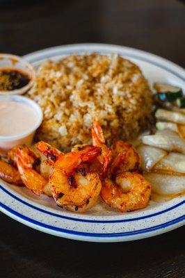 Shrimp Teppan yaki
Shrimp w zucchini & onion. 
Original Japanese BBQ sauce , white sauce and Fried rice.