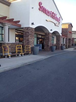 Outside, has shopping baskets, carts, and the big carts.