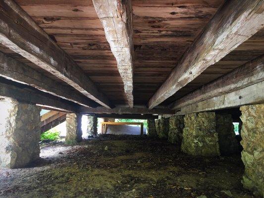 Wood beams under the house.