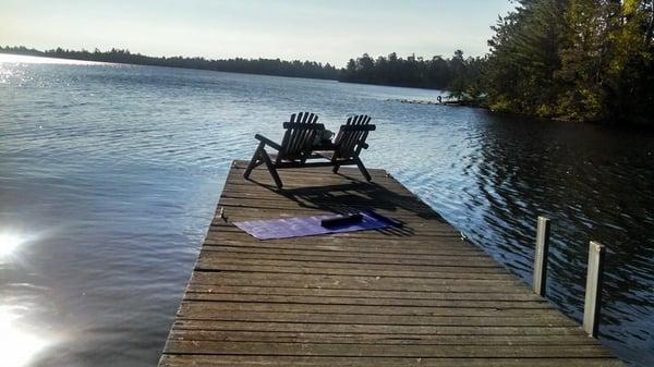 Peace awaits on the sun-warmed dock at the June Yoga Retreat on Atsokan Island, Rainy Lake, International Falls, Minnesota.