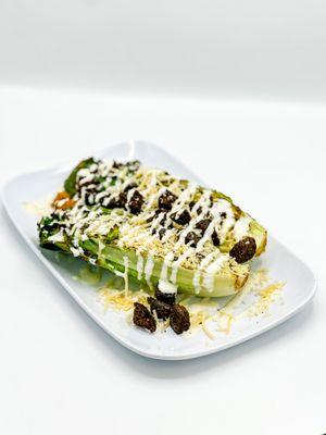 Grilled Caesar Salad: Grilled heart of romaine lettuce, parmesan cheese, homemade croutons and homemade caesar dressing