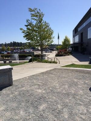 There's a small grassy park outside the library and a small splashing water fountain kids like to run through on sunny days