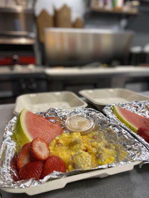 Pizza crust topped with pork sausage gravy, scrambled eggs, breakfast sausage, mama lil's roasted red peppers, cheese, and green onions.