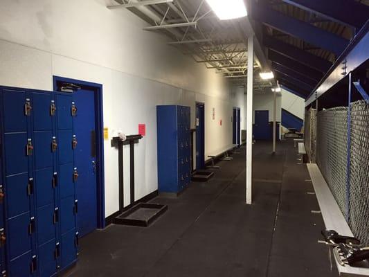 under the bleachers; lockers, bathrooms, team rooms and yards of rubber flooring.