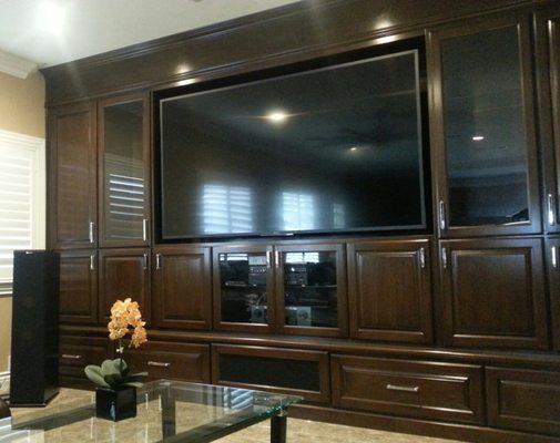 85" Sony TV floating in cabinet.