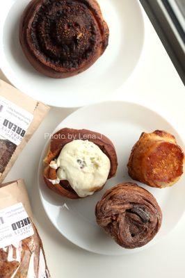 Tomato and Cheese Snail ($3), Cinnamon Roll ($5), Kouign Amann ($5.50), Chocolate Morning Brioche ($6), bread loaves