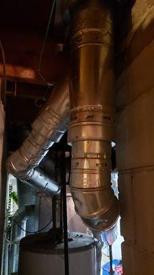 New exhaust pipe for furnace and water heater, into new chimney pipe.