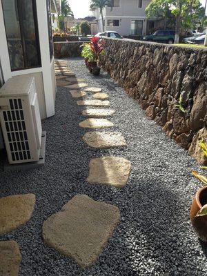 After photo of installation of drainage and xeriscaping with Big Rock tan lava stepping stones.