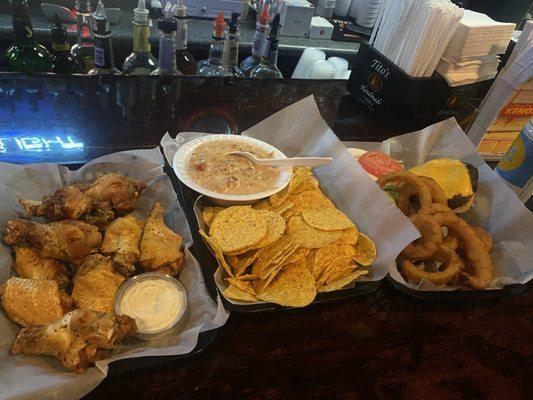 Lemon Pepper Wings, Chips and Queso, and Cheeseburger w/Onion rings.