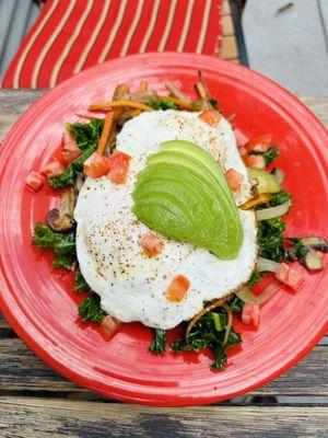 Eggs over easy on kale