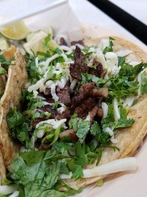 Skirt steak taco with cheese and cilantro