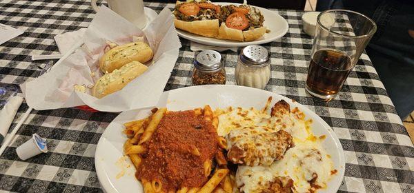 Chicken Parmigiana, Bread that came with my chicken parmigiana, and Frank's Mega Cheese Steak.