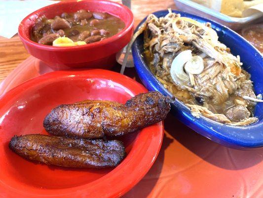 Pork pernil, red beans, and maduros.