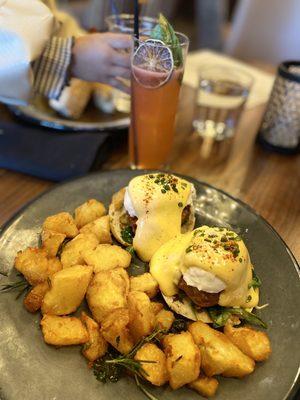 Eggs Benedict with sausage.