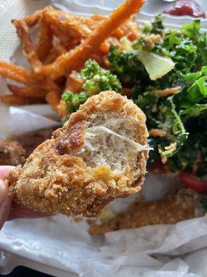 Entree and two sides - "chicken drummies", garlic kale salad, and sweet potato fries