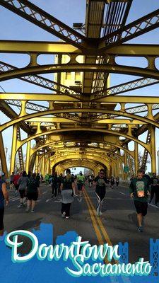 Running across Tower Bridge