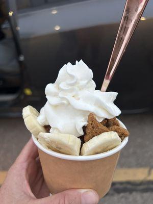 Banana, caramel and biscoff cookies over vanilla ice cream, topped with whipped cream.