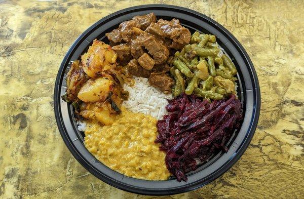 Rice and Curry with Lamb/Mutton. This is the size of a full, deep dinner plate for reference