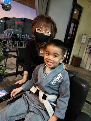 Avery getting his haircut by Carol!