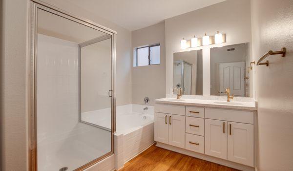 Large bathroom with ample light and double vanity.