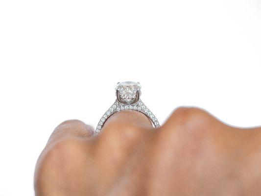 2.5ct Moissanite in a tri-pave diamond band