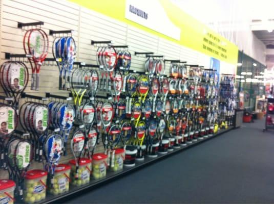 Wall of tennis racquets.